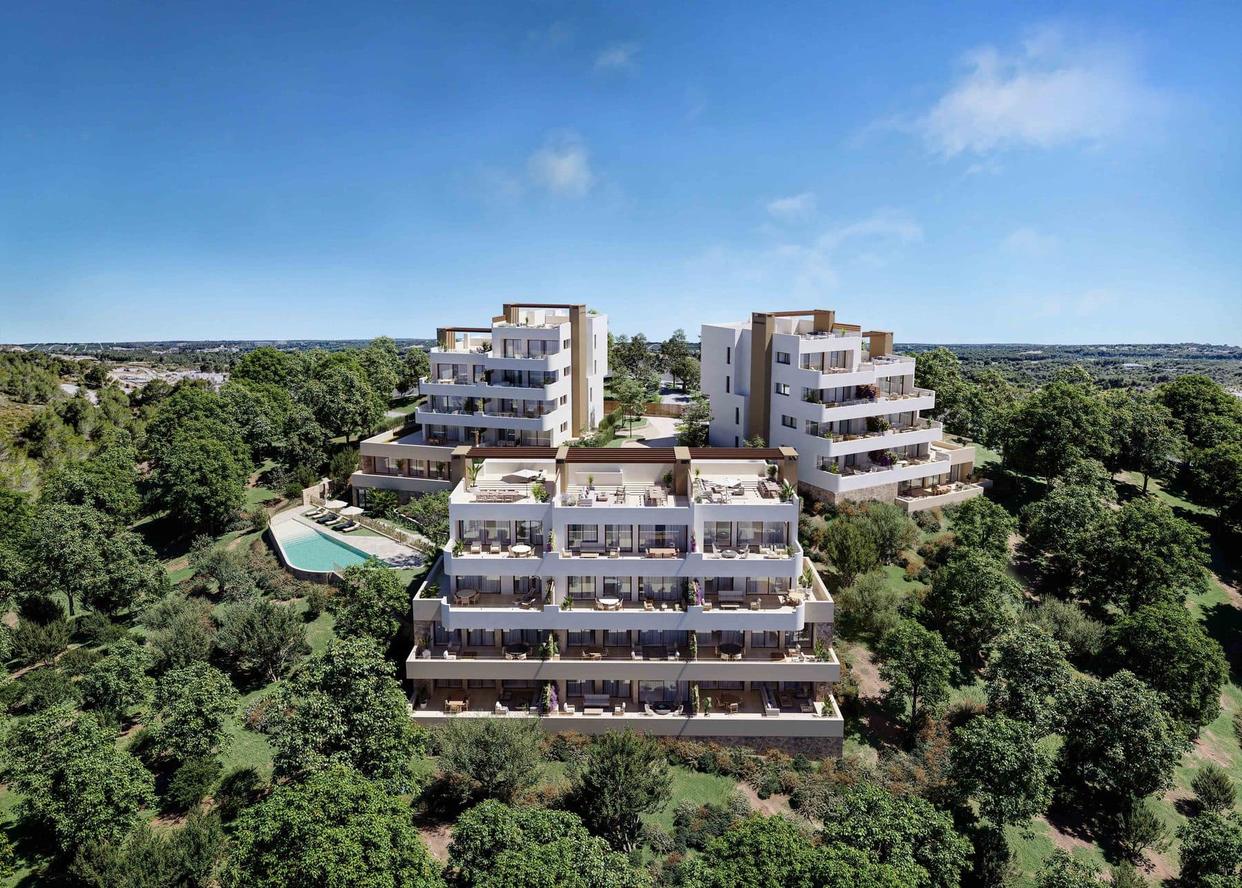 Letecký pohled na tři bloky Buganvilla Apartments a společný bazén